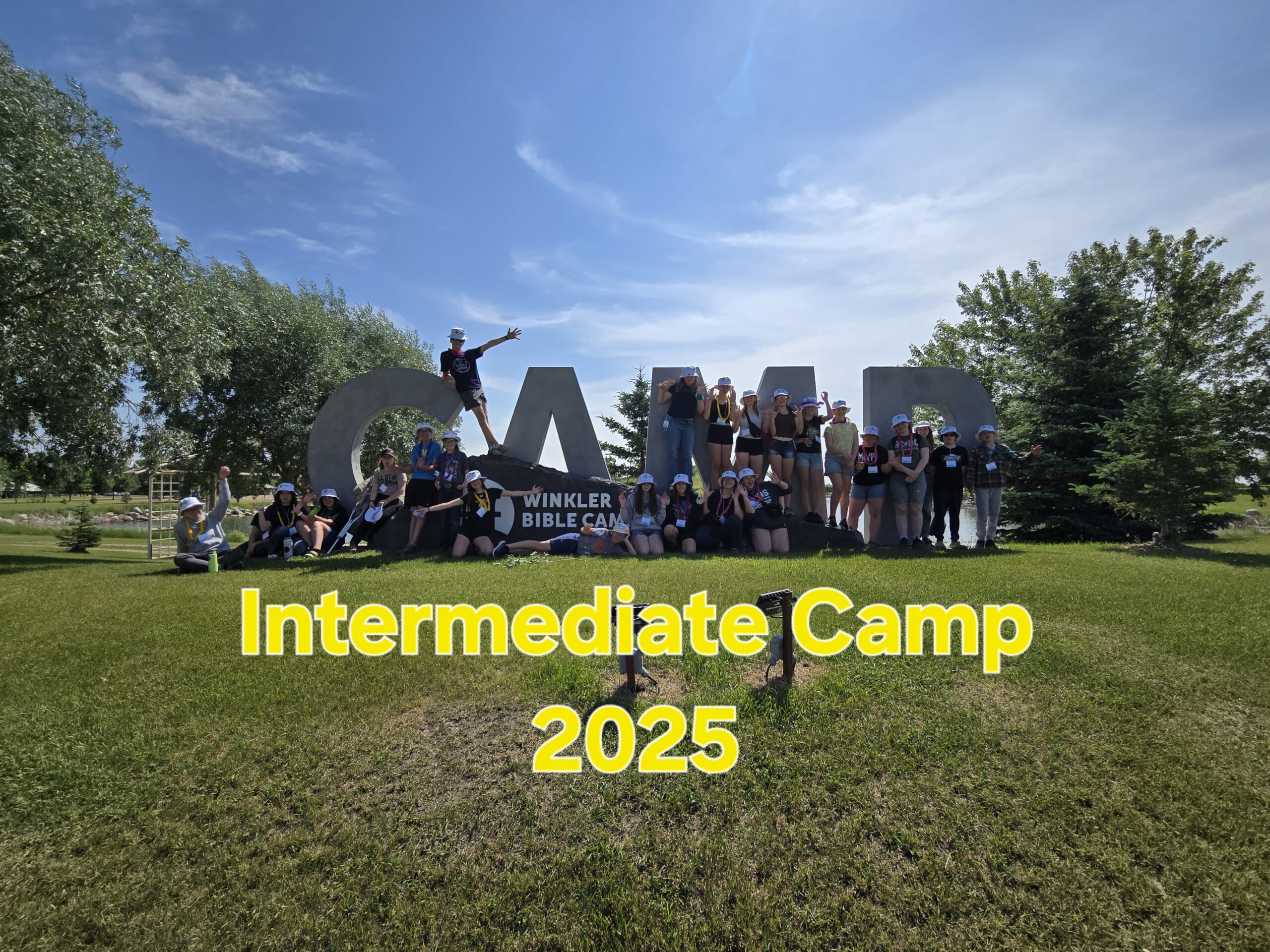 Intermediate Members Event group photo with banners